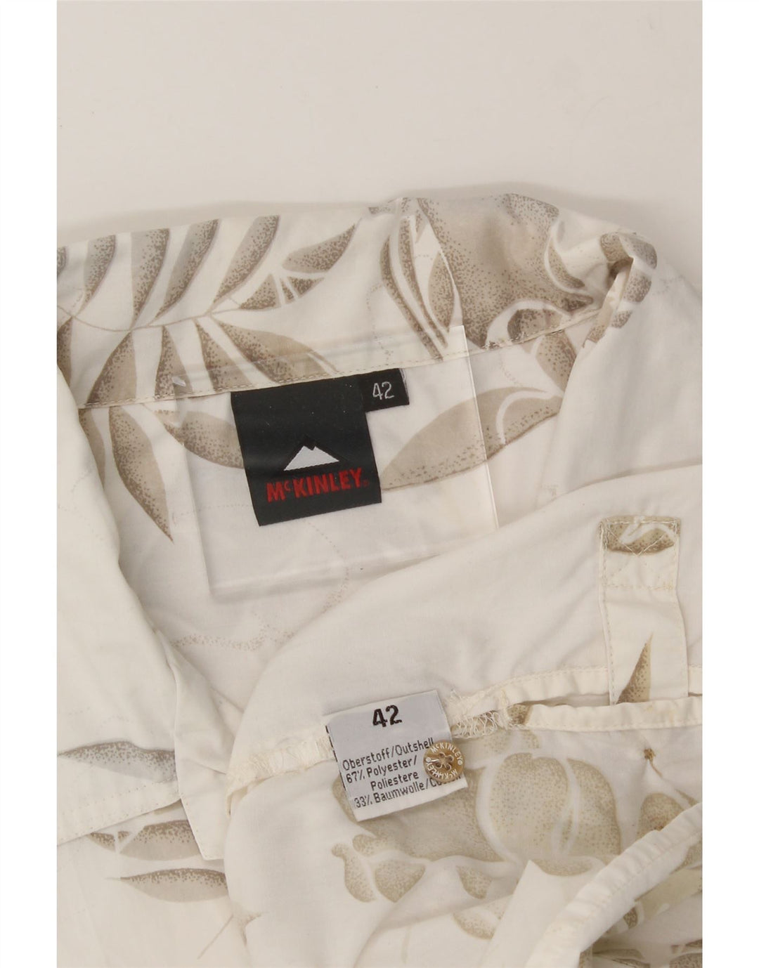 MCKINLEY Womens Short Sleeve Shirt IT 42 Medium Off White Floral Polyester Vintage McKinley and Second-Hand McKinley from Messina Hembry 