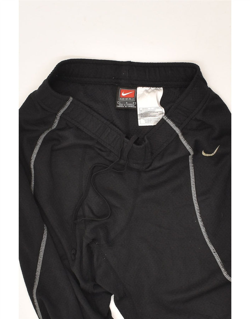 NIKE Boys Tracksuit Trousers 8-9 Years Large Black Polyester | Vintage Nike | Thrift | Second-Hand Nike | Used Clothing | Messina Hembry 