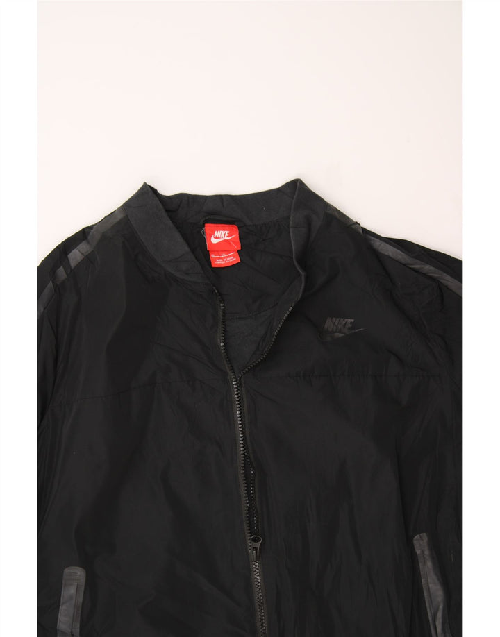 NIKE Womens Oversized Tracksuit Top Jacket UK 18 XL Black Polyester Vintage Nike and Second-Hand Nike from Messina Hembry 