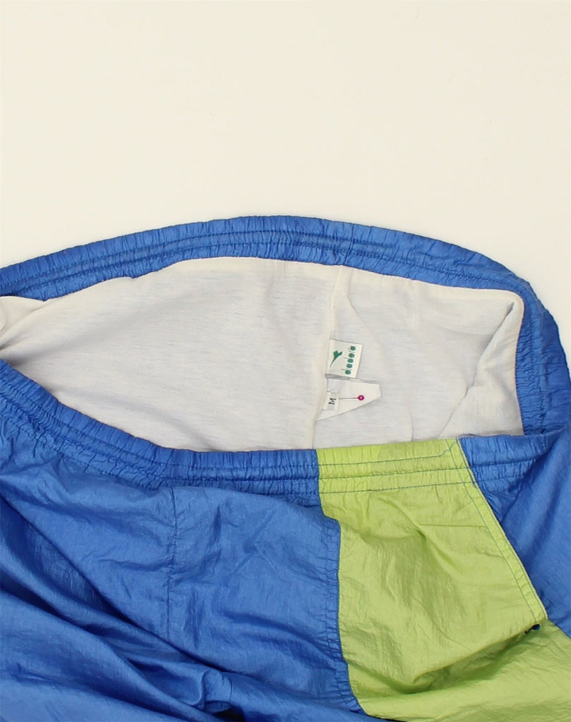 DIADORA Mens Tracksuit Trousers Joggers Medium Blue Colourblock Polyester | Vintage Diadora | Thrift | Second-Hand Diadora | Used Clothing | Messina Hembry 