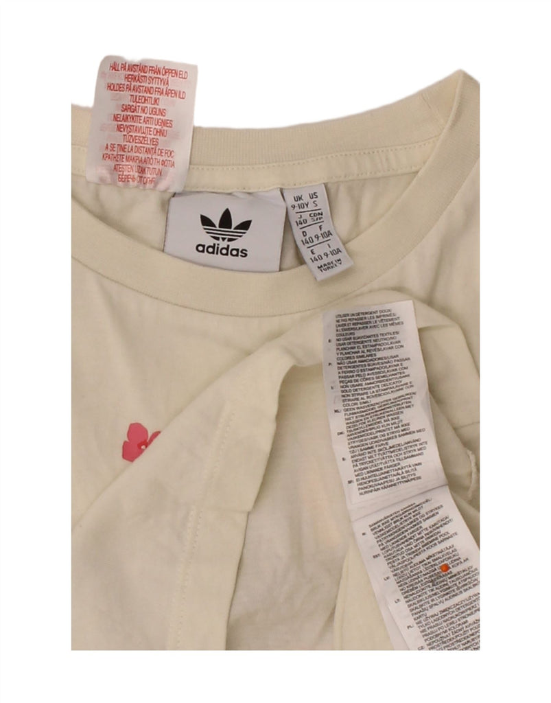 ADIDAS Girls Graphic T-Shirt Top 9-10 Years Off White Floral Cotton Vintage Adidas and Second-Hand Adidas from Messina Hembry 