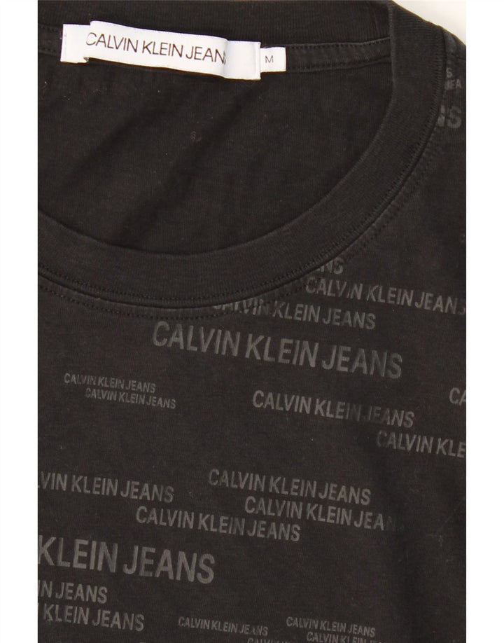 CALVIN KLEIN JEANS Mens Graphic T-Shirt Top Medium Black Cotton Vintage Calvin Klein Jeans and Second-Hand Calvin Klein Jeans from Messina Hembry 