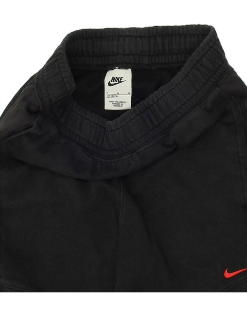 NIKE Boys Graphic Tracksuit Trousers Joggers 10-11 Years Medium Black Vintage Nike and Second-Hand Nike from Messina Hembry 