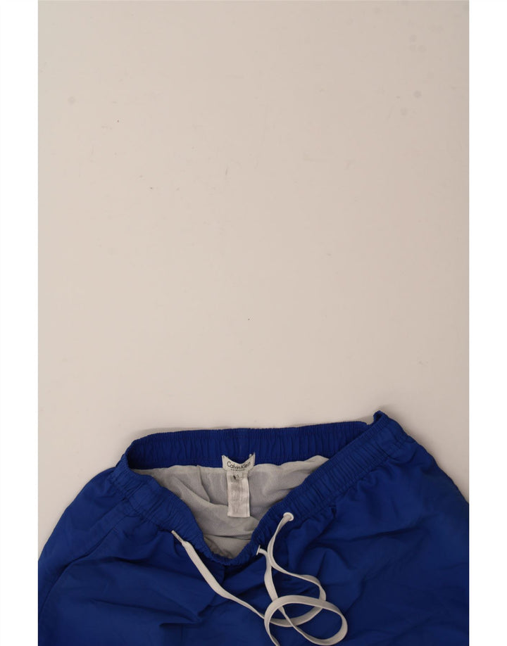 CALVIN KLEIN Mens Graphic Sport Shorts Small  Blue Nylon Vintage Calvin Klein and Second-Hand Calvin Klein from Messina Hembry 