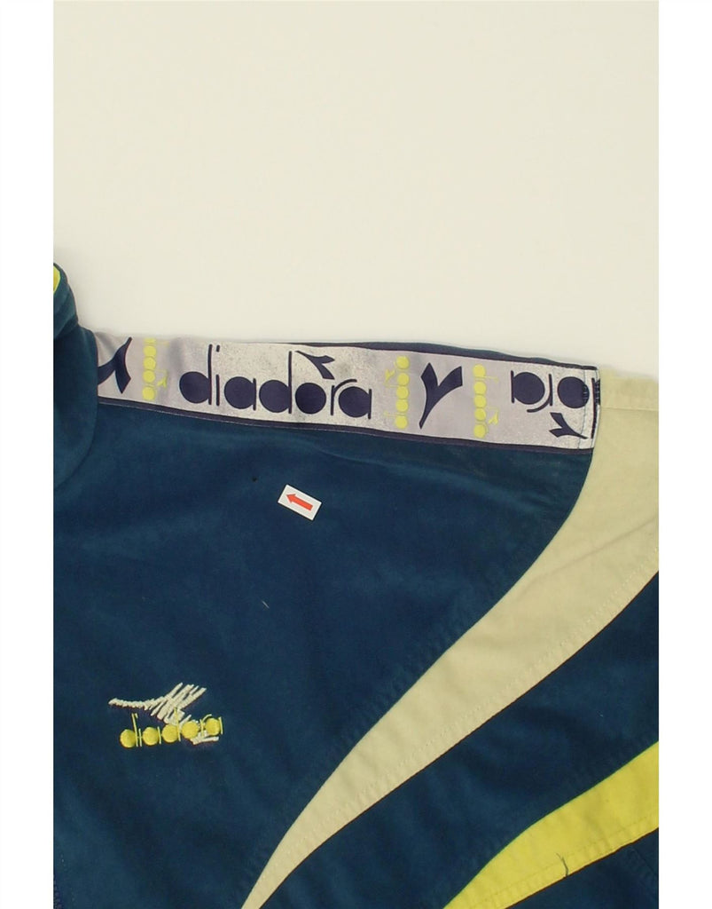 DIADORA Mens Loose Fit Graphic Tracksuit Top Jacket UK 40 Medium Blue Vintage Diadora and Second-Hand Diadora from Messina Hembry 